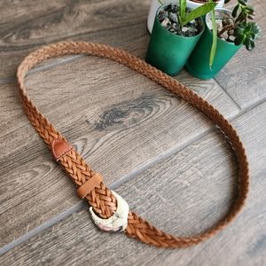 Woven leather belt with silver western style buckle in honey colored tan
